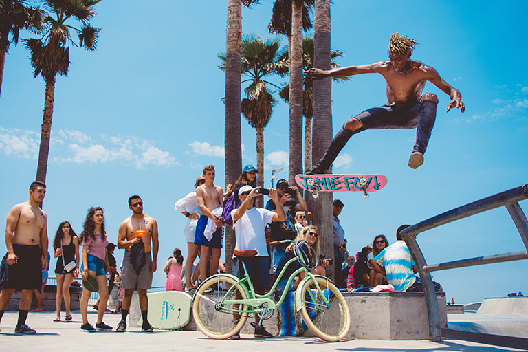 skateboarder performing tricks at Venice Beach